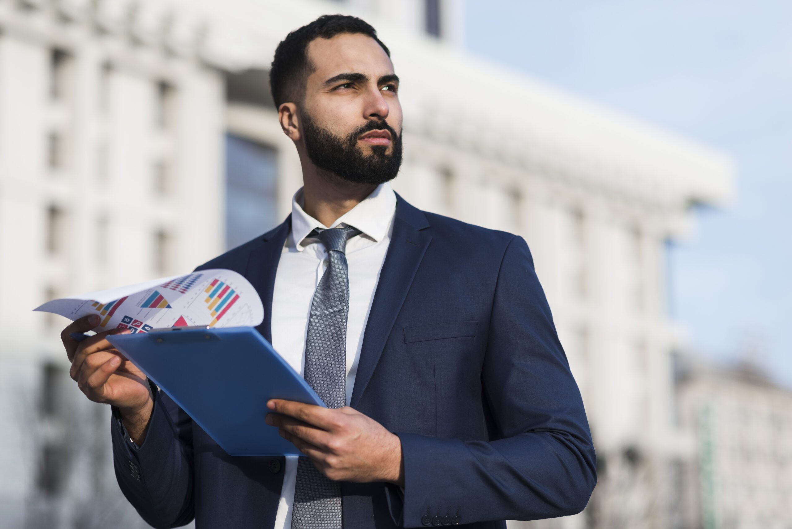 low-angle-business-man-with-clipboard